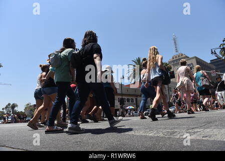 HOLLYWOOD - August 7, 2018: People crossing the road from low angle point of view on Hollywood blvd in Hollywood, CA. Stock Photo