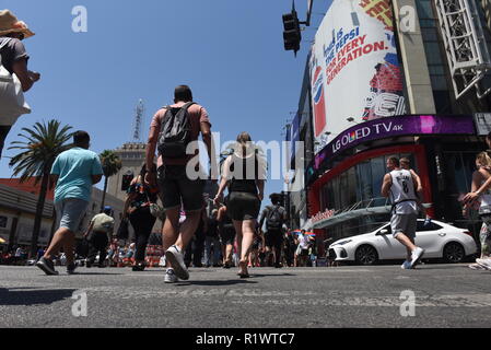 HOLLYWOOD - August 7, 2018: People crossing the road from low angle point of view on Hollywood blvd in Hollywood, CA. Stock Photo