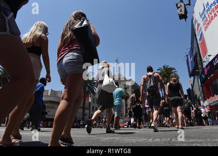 HOLLYWOOD - August 7, 2018: People crossing the road from low angle point of view on Hollywood blvd in Hollywood, CA. Stock Photo