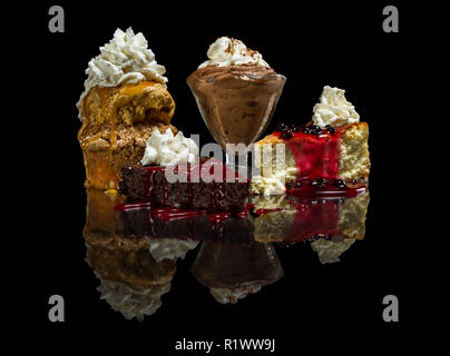 restaurant sampler of dessert isolated on a black background Stock Photo