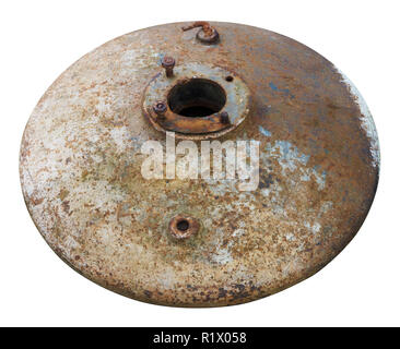 Heavy rusty round manhole cover from retro farm machinery. Isolated on white Stock Photo