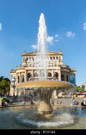Frankfurt -  Germany, September, 5th, 2018 - the Old Opera House Alte Oper in Frankfurt Main in summer with Opernplatz fountain and walking people. Stock Photo
