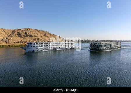 River Nile cruise ships on the River Nile early in the morning at Esna City on their way to Aswan, Egypt, Africa Stock Photo