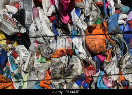 Pressed plastic waste cubes for recycling at the Mixed-waste processing facility stores in Russia. Stock Photo