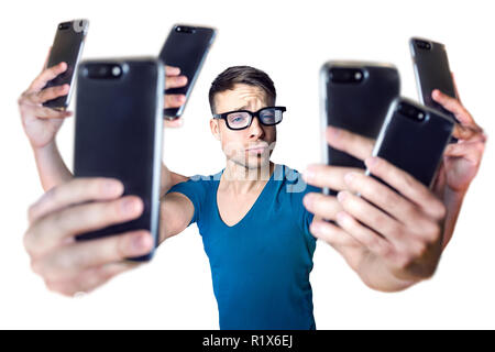 Influencer holding an exaggerated number of smartphones - isolated on white Stock Photo