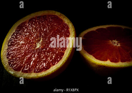 Ruby red grapefruit sliced in half Stock Photo