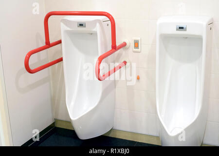 Urinals for the disabled in public toilets. Public toilets for the disabled Stock Photo