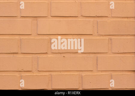 Painted orange brick wall texture background Stock Photo