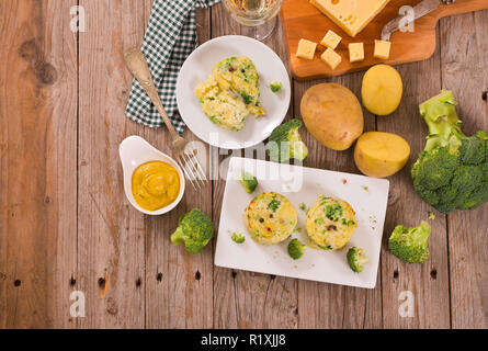 Potato gratins with broccoli florets.