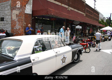 Andy Griffith's sheriff vehicle on display, along with vintage tractors, at Mayberry Day festival in Mount Airy, North Carolina, USA Stock Photo