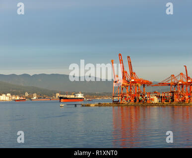 Gantry cranes and container ships in Burrard Inlet, Port of Vancouver, BC, Canada Stock Photo