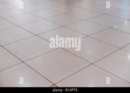 Beige tile on the floor in perspective Stock Photo