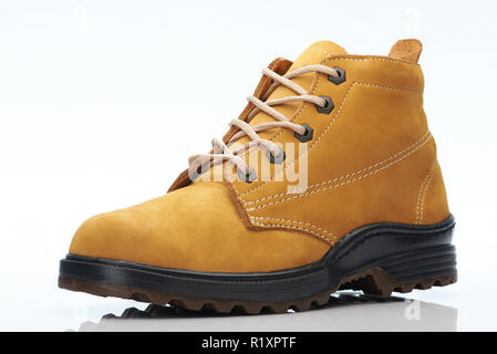 Yellow hiking boot angle view isolated on white background Stock Photo