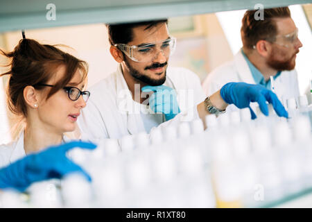 Group of chemistry students working in laboratory Stock Photo