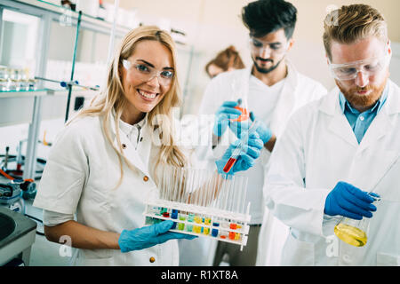 Group of chemistry students working in laboratory Stock Photo