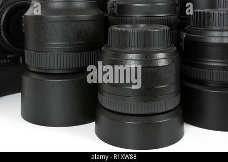 Collection of professional and modern lenses and DSLR camera in close-up. Stock Photo