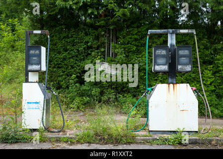 Abandoned Severn Fuels fuel filling station with derelict petrol pumps in Pembrokeshire, Wales, UK Stock Photo