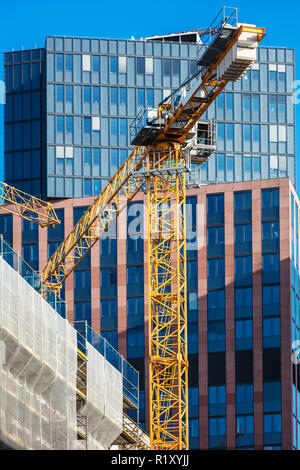 crane is used in the construction of  buildings. Stock Photo