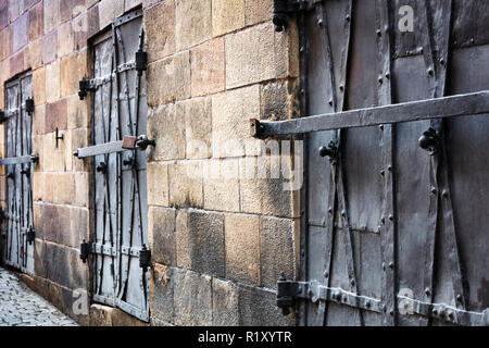 old windows closed with iron shutters Stock Photo