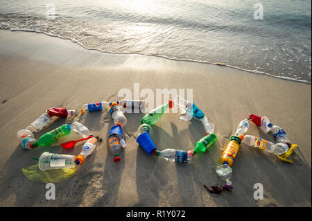 MIAMI - CIRCA AUGUST, 2018: Ocean plastic pollution awareness message spelling out STOP made from consumer drink bottles found on the beach Stock Photo