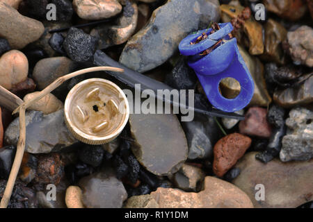 Plastic objects found in the bank of the River Thames to show the high use of Plastic used in the environment. Stock Photo