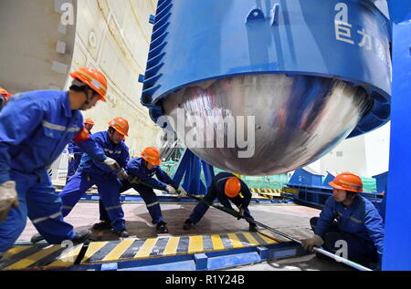 (181115) -- BEIJING, Nov. 15, 2018 (Xinhua) -- Workers are seen at the installation site of reactor pressure vessel (RPV) of the No.5 unit of China National Nuclear Corporation's Fuqing nuclear power plant in southeast China's Fujian Province, Jan. 28, 2018. According to the National Bureau of Statistics, China's power generation rose 7.2 percent year-on-year in the first 10 months of 2018. In October alone, China generated 533 billion kilowatt-hours (kWh) of power, up 4.8 percent year on year, faster than the 4.6-percent growth in September. The average daily power generation reached 17.2 bil Stock Photo