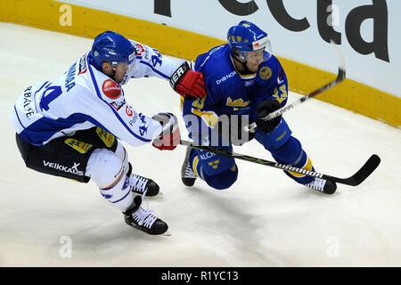 Liberec, Czech republic. 18th Apr, 2009. Euro Hockey Tour, Finland vs Sweden republic, 4:5, 18 April 2009, Liberec, CZE. Finland's Janne Niinimaa (L) and Sweden's Linus Omark (R) fight for the puck during their Euro Hockey Tour ice hockey match in Liberec April 18, 2009./PSPA/Slavek Ruta Credit: Slavek Ruta/ZUMA Wire/Alamy Live News Stock Photo