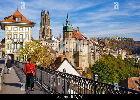 Fribourg, Switzerland, view of the Lower Town with in the background, the St. Nicholas Cathedral and the Gottéron Bridge. Stock Photo