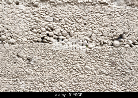 Concrete wall pattern made with bigger pebbles than usual Stock Photo