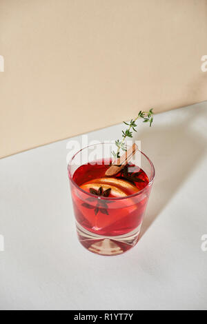 Christmas or Thanksgiving drink. Autumn and winter cocktail - grog, hot sangria, mulled wine with tea, lemon, rome, cinnamon, anise and other spices. Stock Photo
