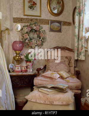 Dried flower wreath and pink chair in old-fashioned bedroom Stock ...