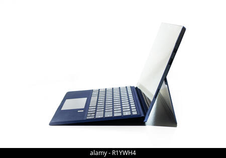 Compact laptop  tablet opened exposed keys pure white background blue key pad Stock Photo