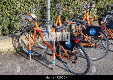 WORTHING, WEST SUSSEX/UK - NOVEMBER 13 : orange bikes for hire in Worthing West Sussex on November 13, 2018 Stock Photo