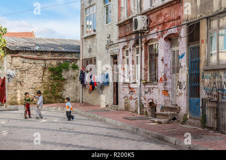 Istanbul, Turkey, November 13, 2012: Three small children playing in a street in Balat district. Stock Photo