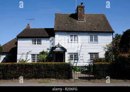 Pond Cottage, Essendon, Hertfordshire, is a white weather boarded building which was once the village post office. Stock Photo