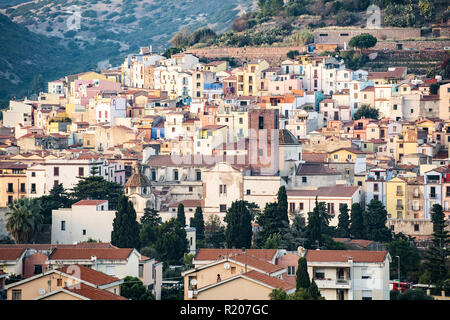 The beautiful village of Bosa with colored houses and a medieval castle on the top of the hill. Bosa is located in the north-west of Sardinia, Italy. Stock Photo