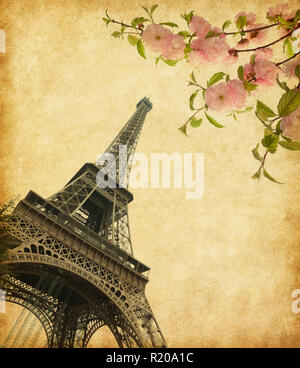 Eiffel Tower in spring time, Paris, France. Photo in retro style. Added  paper texture. Stock Photo