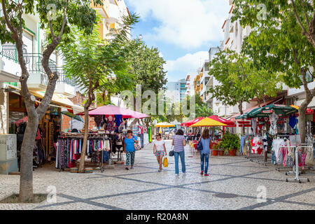 Pedestrian precinct in Monte Gordo town centre with shops and cafes, Algarve, Portugal Stock Photo