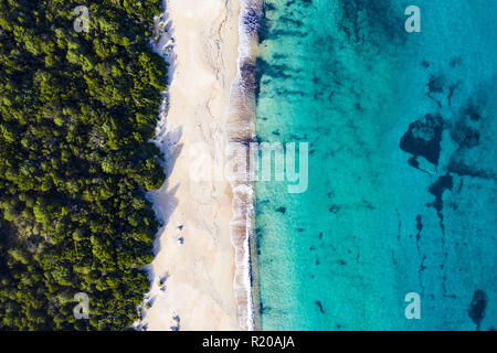 Aerial view of an amazing wild beach bathed by a transparent and turquoise sea. Sardinia, Italy. Stock Photo