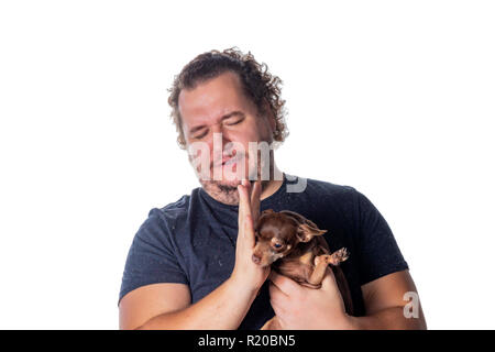 Funny fat man with little dog Stock Photo
