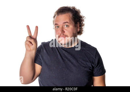 Portrait of funny fat man showing peace v-sign or victory gesture Stock Photo