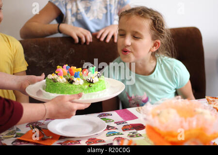 Happy children at a birthday girl's party Stock Photo