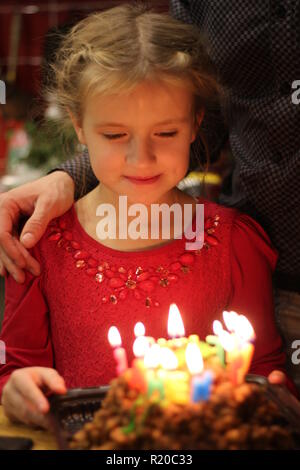 Happy children at a birthday girl's party Stock Photo