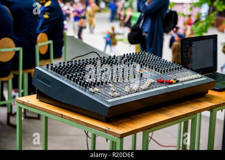 Close up shot of a mixer desk with many knobs Stock Photo