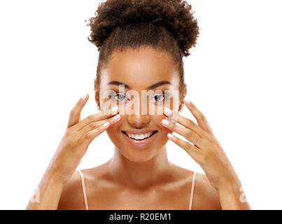 Attractive woman doing facial massage. Photo of african american woman with clean healthy skin on white background. Skin care and beauty concept Stock Photo