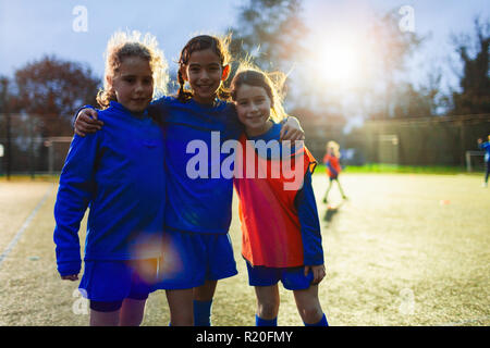 Portrait smiling, confident girl soccer players Stock Photo