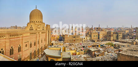 The view from the Bab Zuwayla gate on the slums of Islamic Cairo, Al Muizz street and facade of Sultan Al-Mu'ayyad mosque, Egypt. Stock Photo