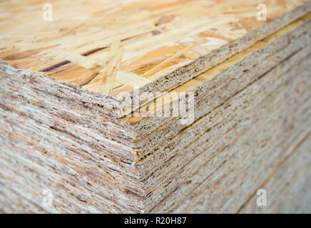 A stack of OSB sheets stacked one on another Stock Photo