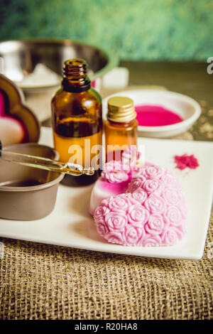 Making soap from pour and melt soap base concept. Soap making ingredients  on brown wooden background. melt and pour method, buy a soap base Stock  Photo - Alamy