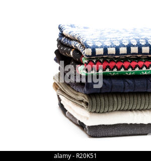 Folded  knitwear sweaters isolated on white Stock Photo